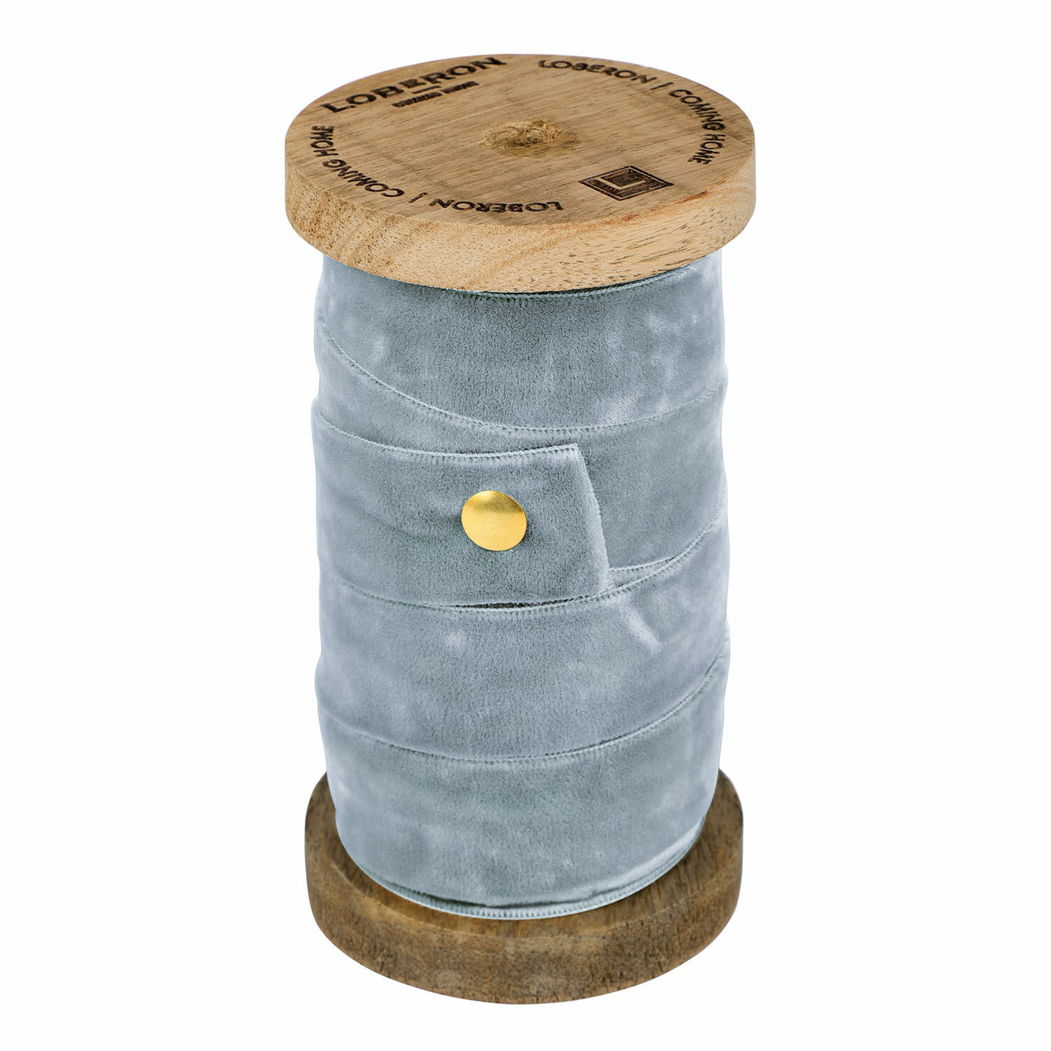 Ruban en velours bleu enroulé sur une bobine en bois pour décoration et artisanat