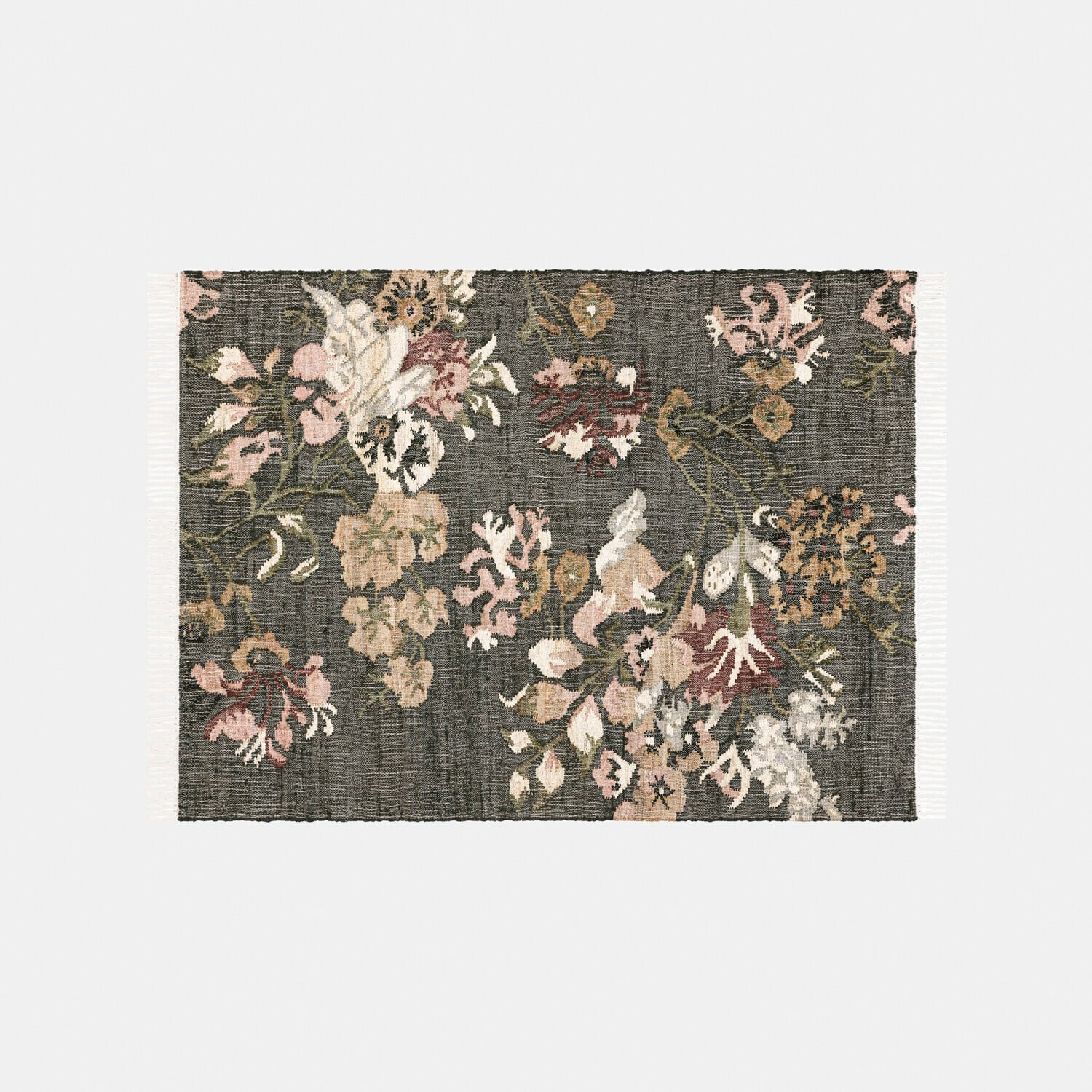 Tapis en tissu gris foncé avec motif floral pastel et franges décoratives sur les côtés