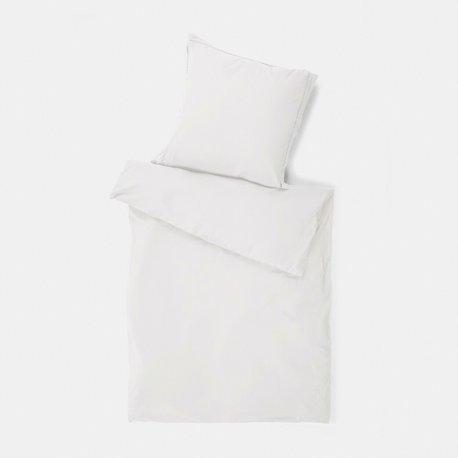 Parure de lit blanche en coton doux avec taie d'oreiller et housse de couette, style épuré