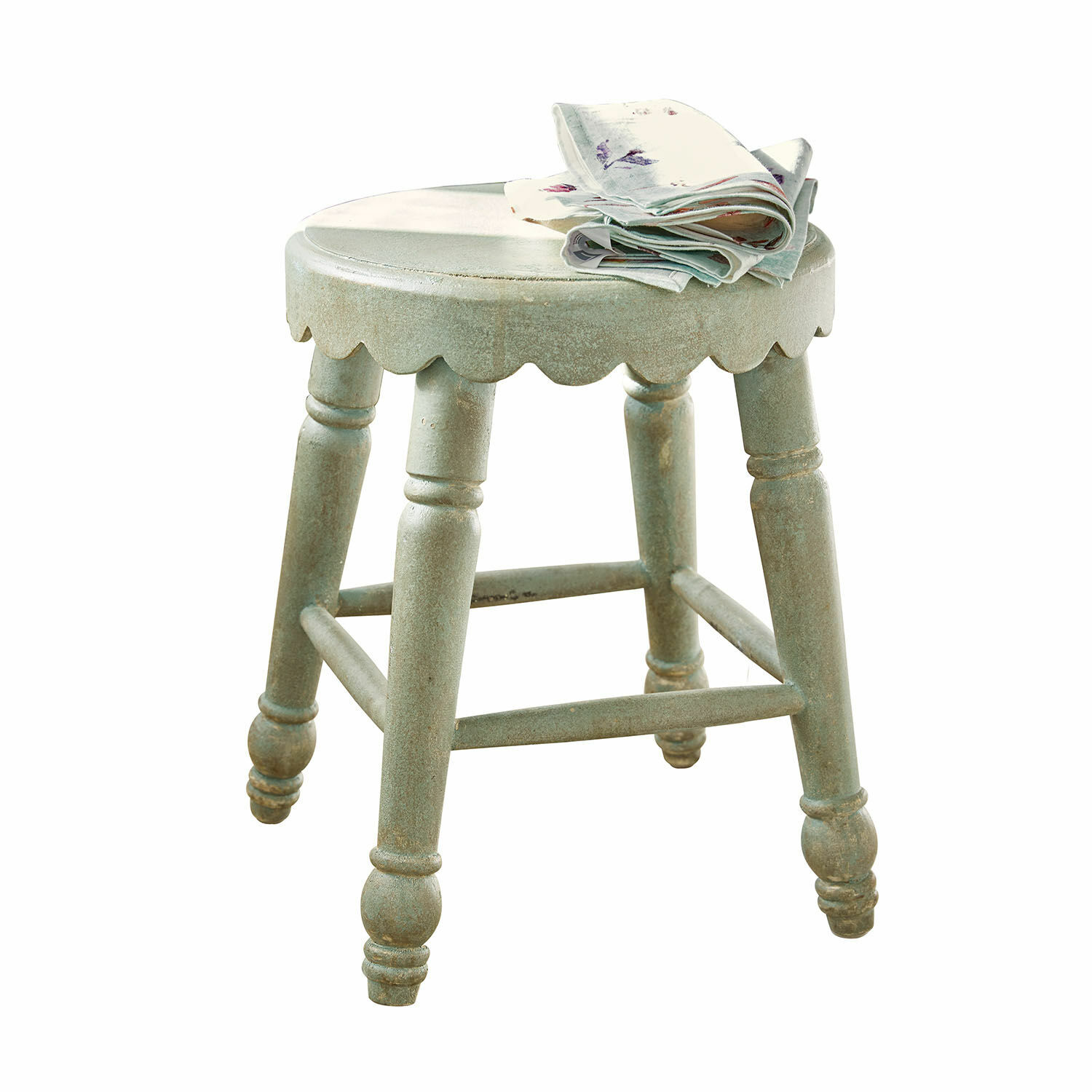 Tabouret Nirvent Tabouret rond en bois vert avec bord festonné et tissu plié sur l'assise