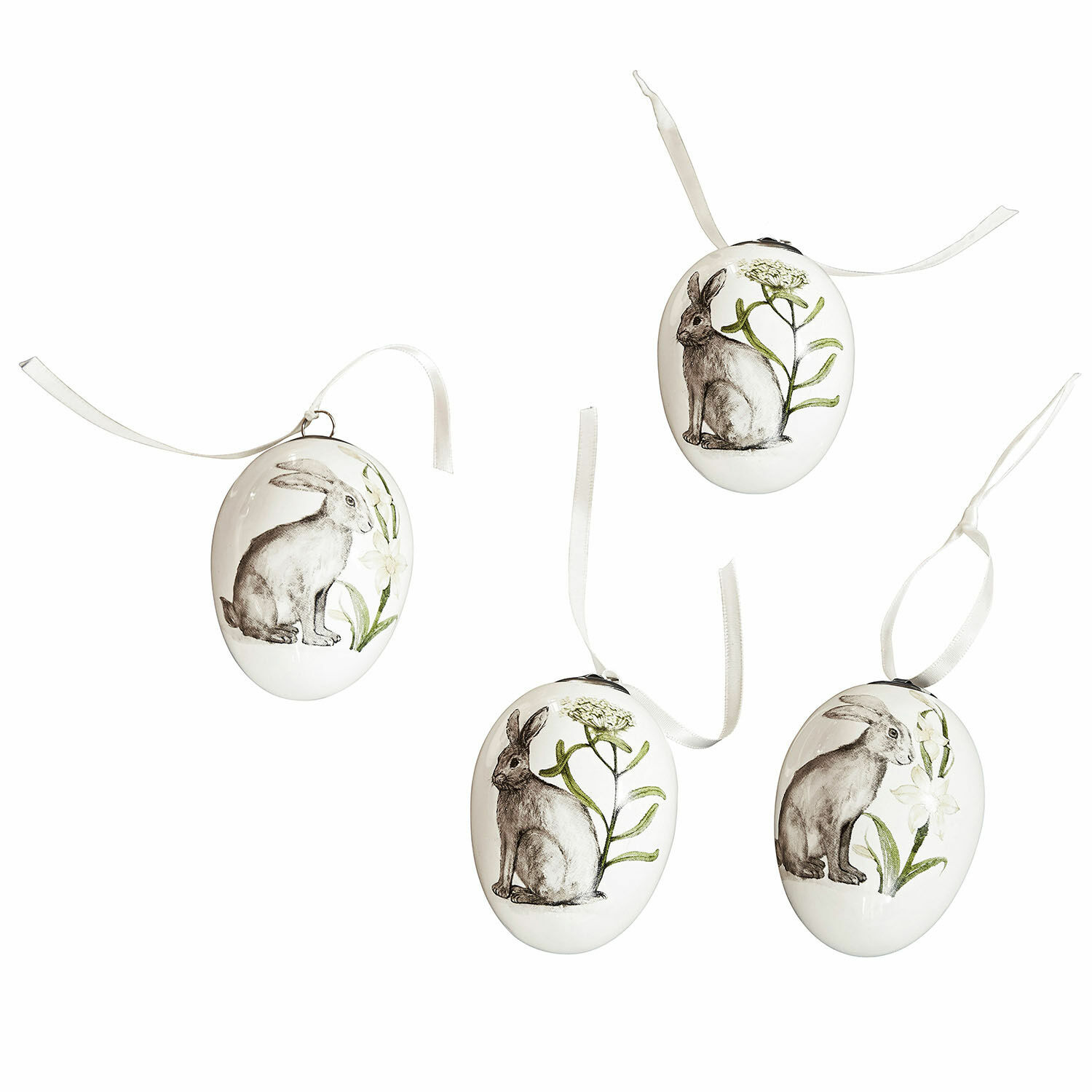 Lot de 4 œufs de Pâques Finna Ensemble de quatre œufs en céramique blanche avec illustrations de lapins et plantes vertes, décorations de Pâques