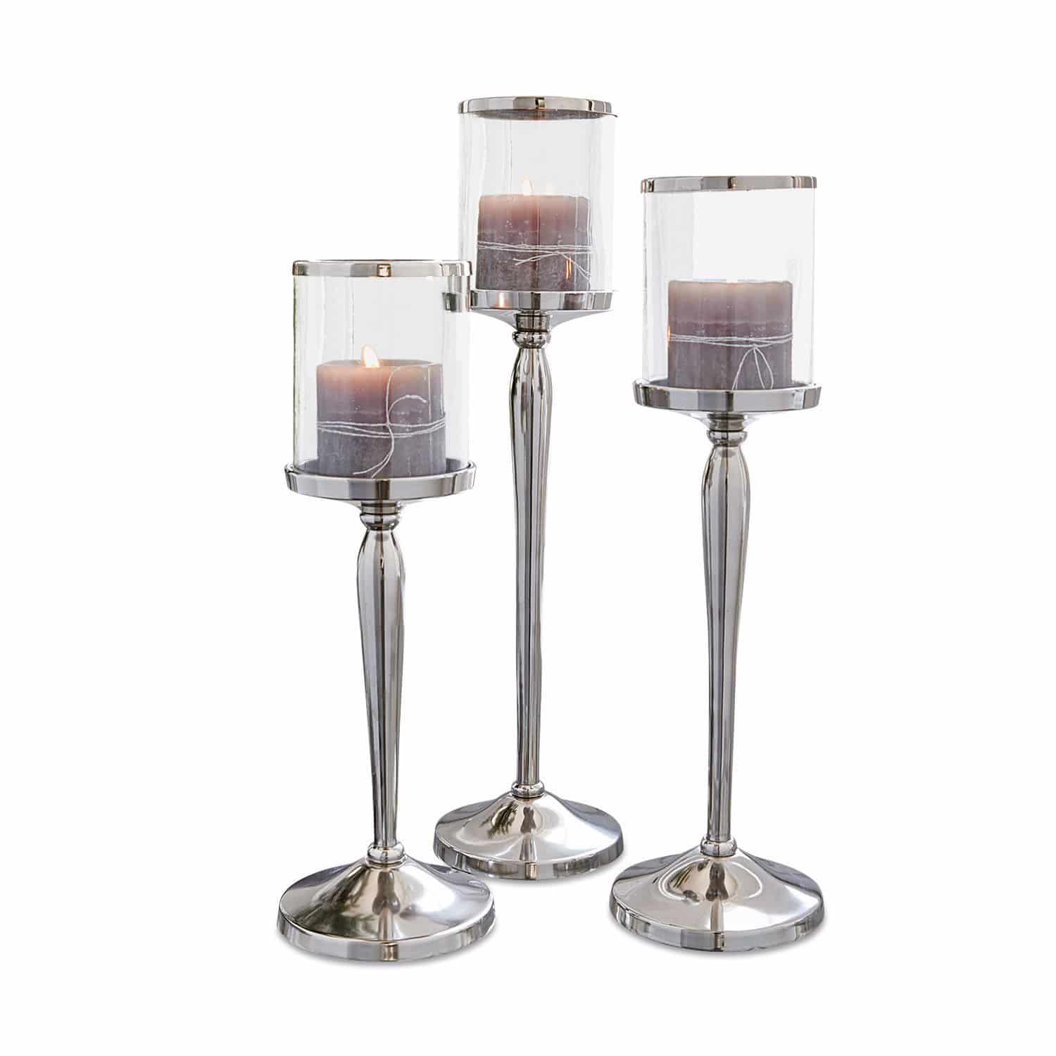 Lot de 3 bougeoirs Serres Ensemble de trois bougeoirs en métal argenté et verre avec bougies grises décoratives