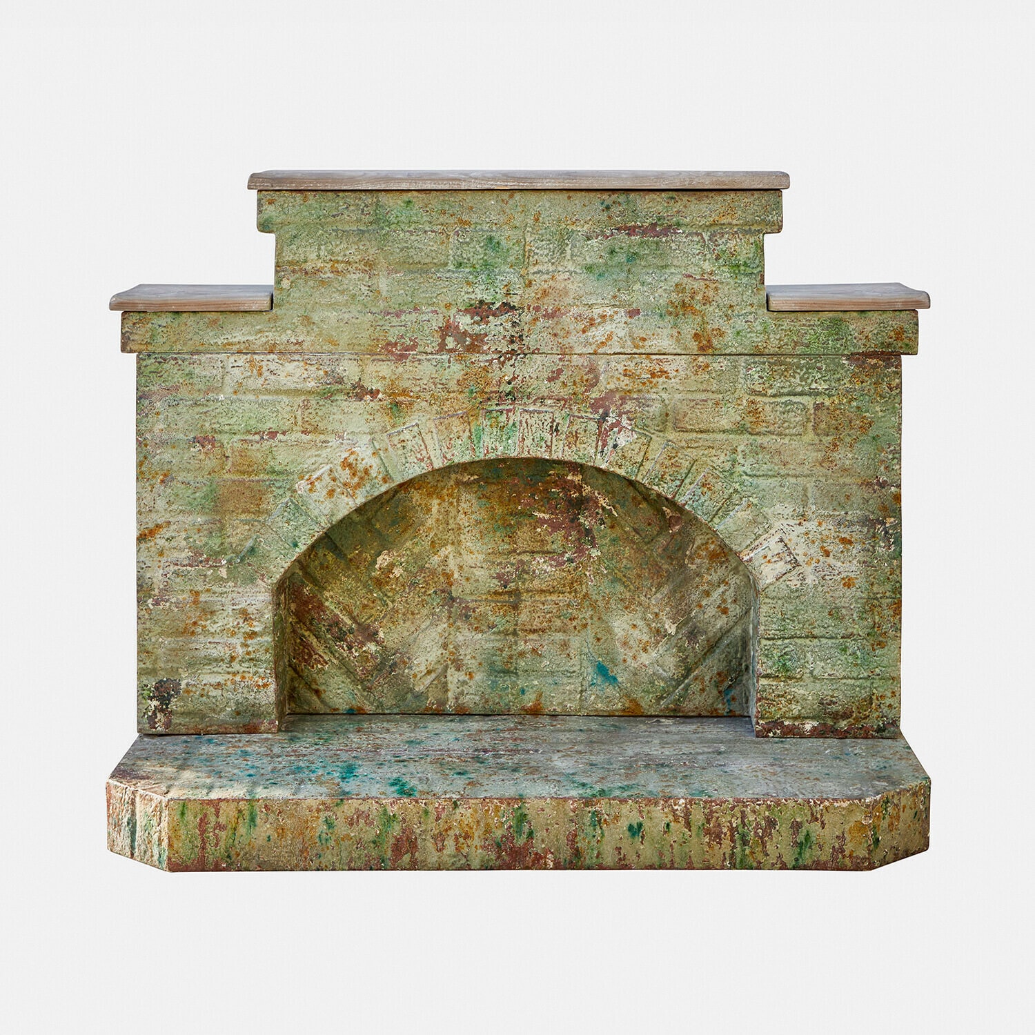 Manteau de cheminée Kestonbury Cheminée décorative effet pierre vieillie en nuances vertes et brunes pour un intérieur rustique
