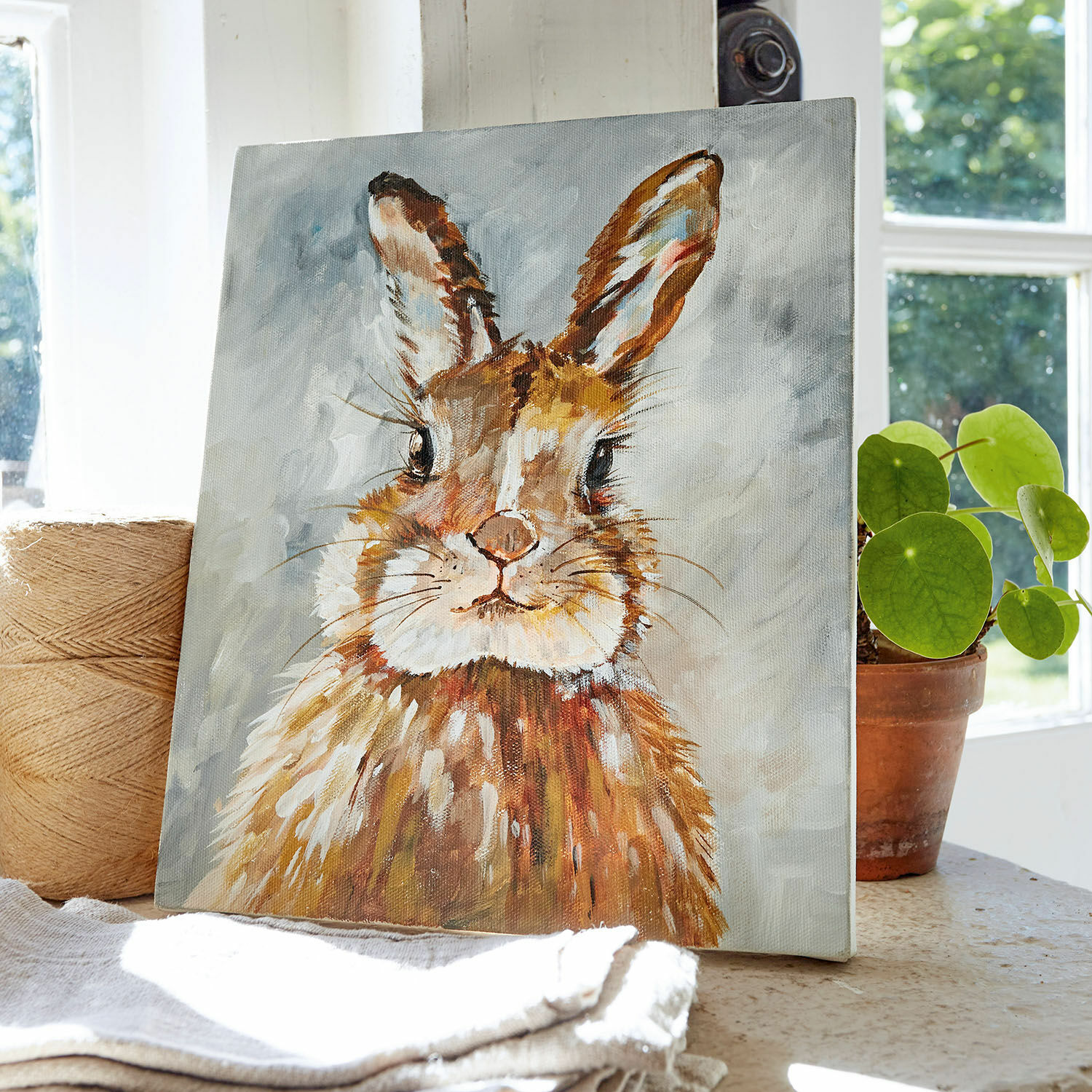 Tableau Magnus Tableau sur toile représentant un lapin brun peint sur fond gris pour décoration intérieure