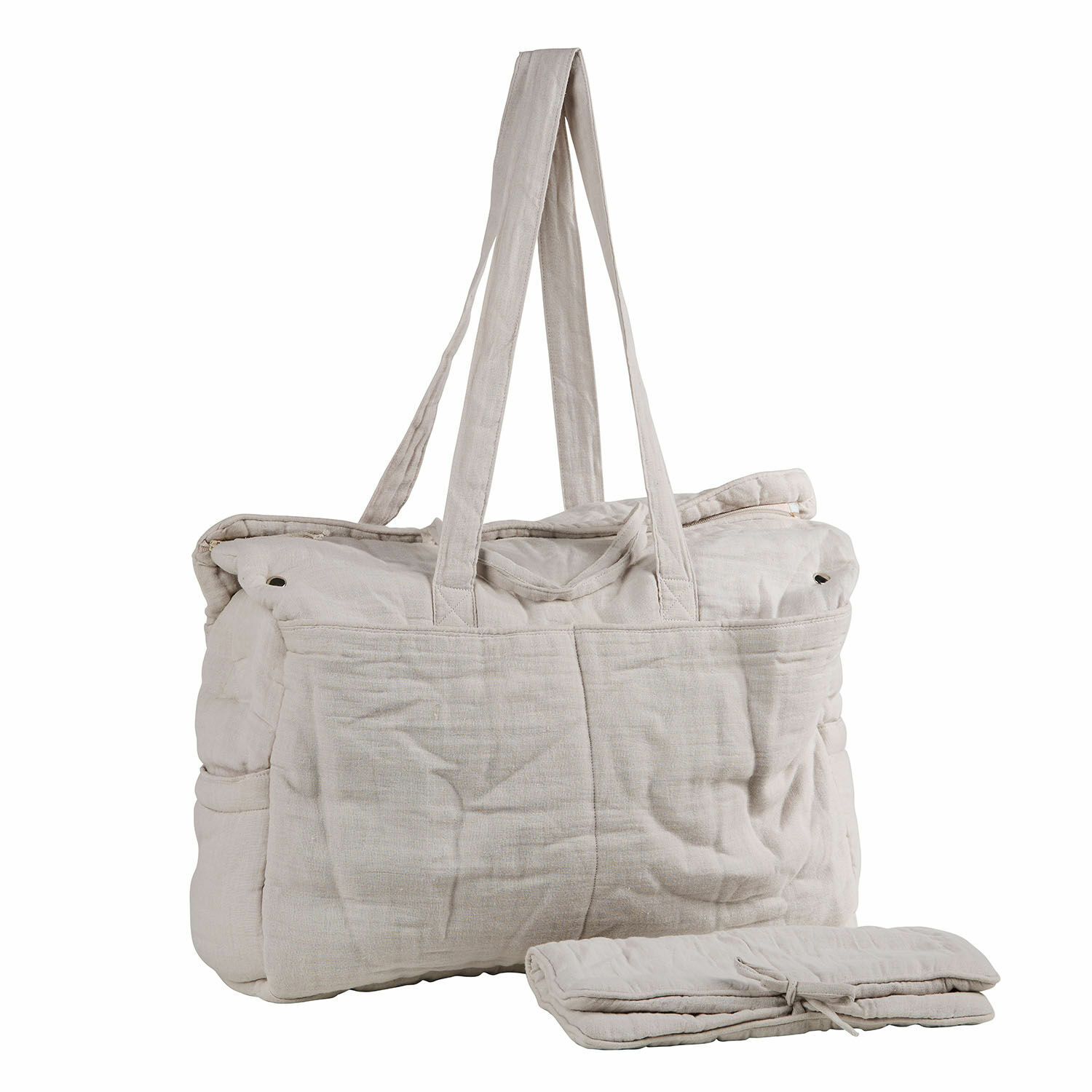Sac à langer Mireval Sac de voyage beige en tissu avec longues anses et élément plié à côté, sac pratique