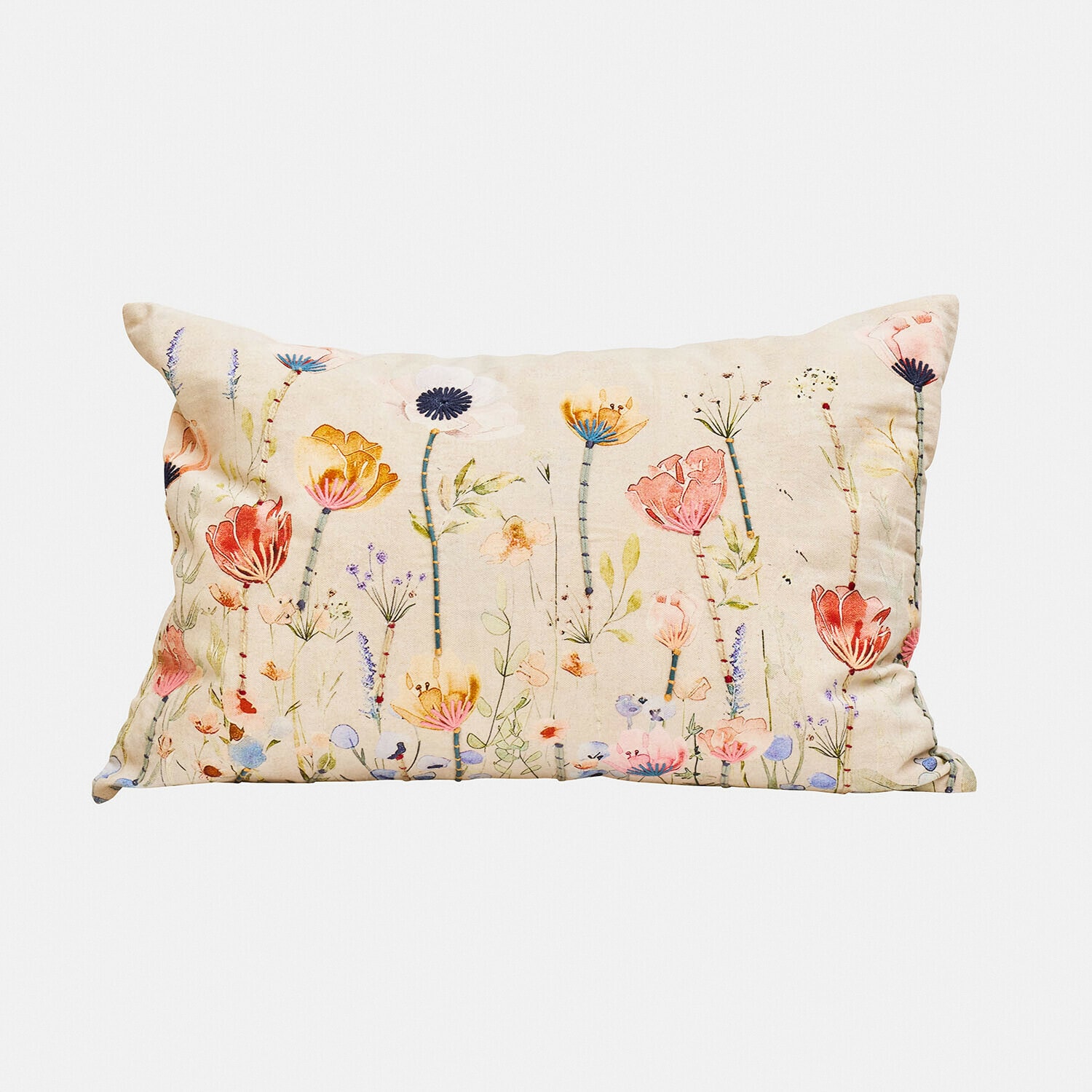 Coussin rectangulaire en coton beige avec imprimé floral coloré pour décoration intérieure