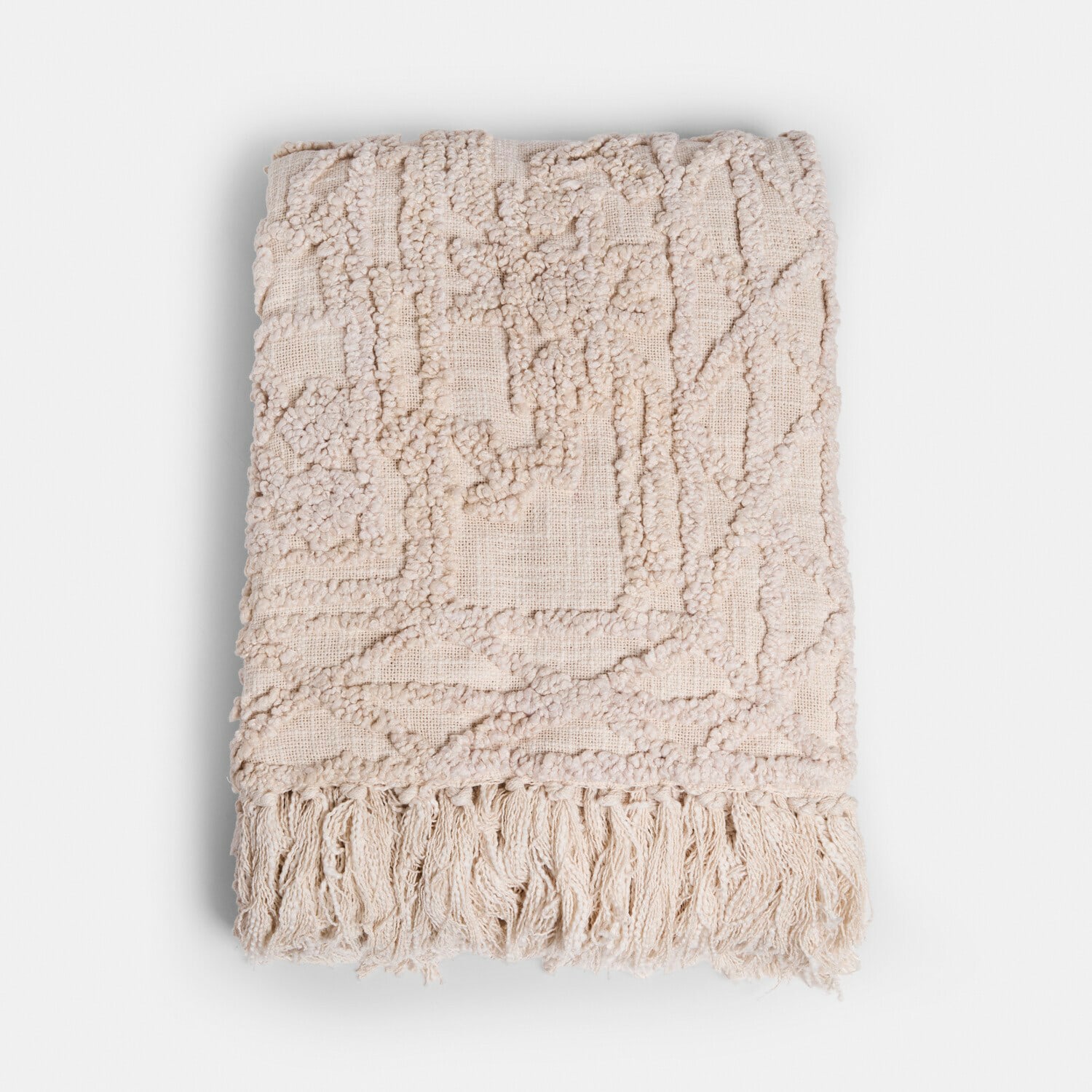 Plaid crème en coton avec franges et motif géométrique, couverture douce et décorative pour salon