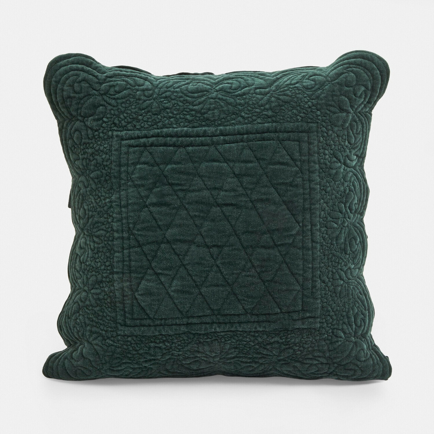 Coussin vert en velours avec motif matelassé et bordure décorative, accessoire déco