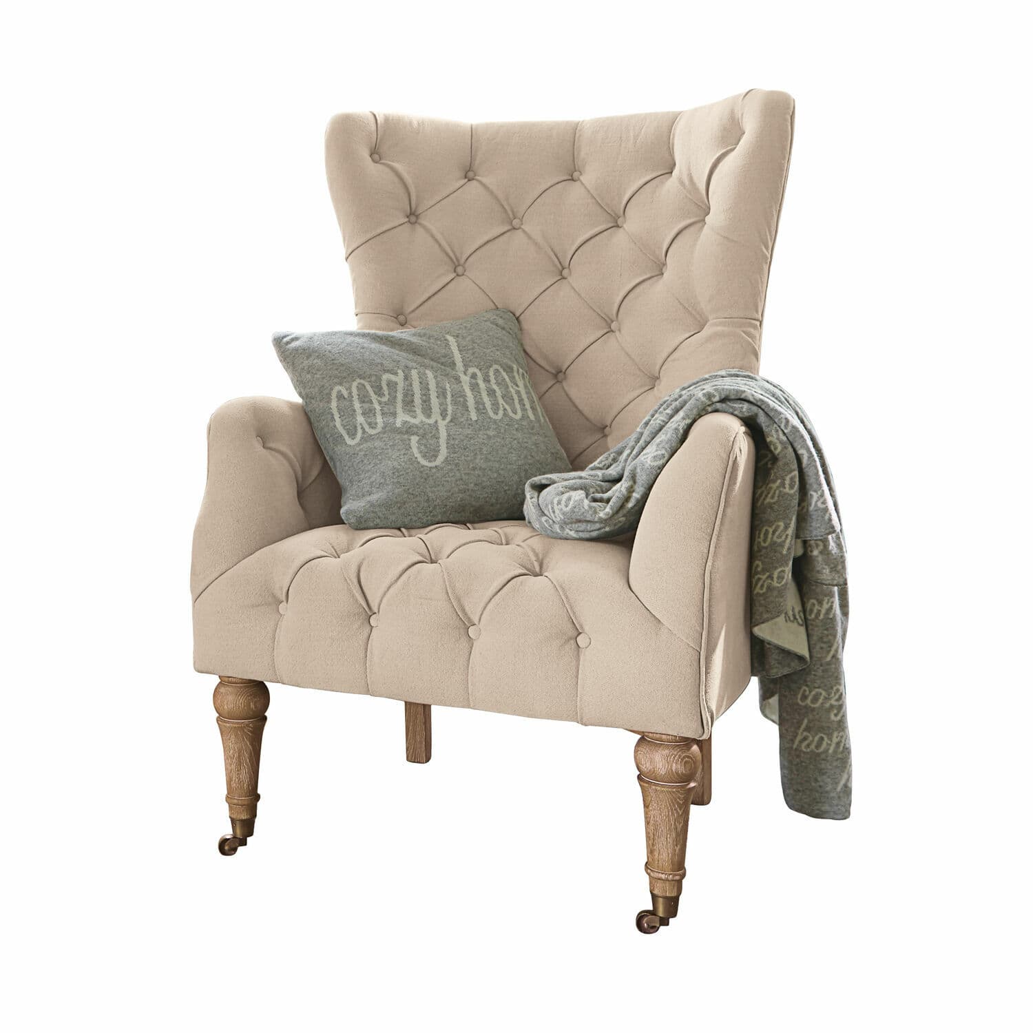 Fauteuil Migré Fauteuil beige capitonné avec pieds en bois, coussin et plaid gris cozy home pour salon
