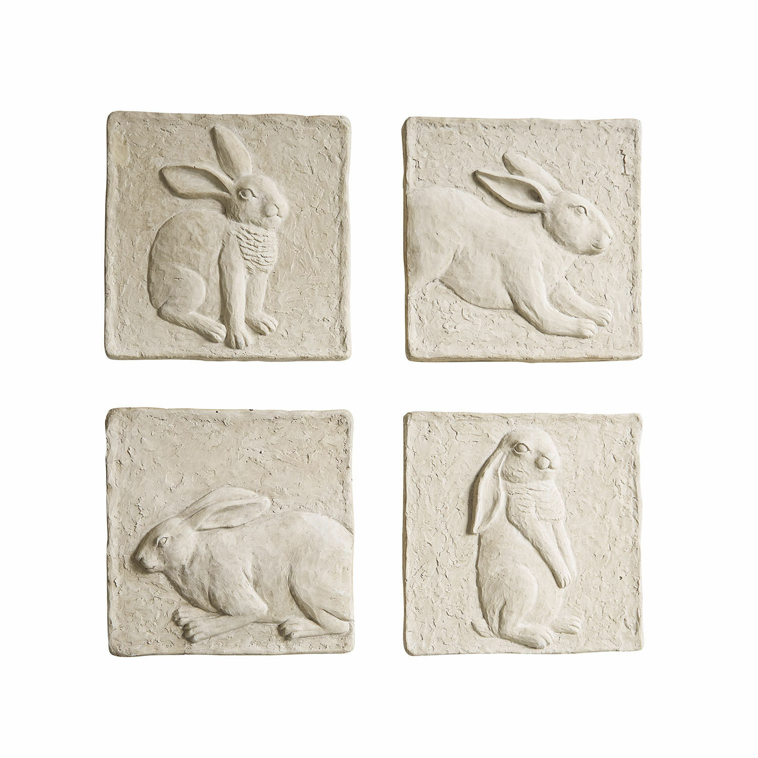 Lot de 4 tableaux Cervique Ensemble de quatre plaques décoratives en pierre beige avec reliefs de lapins pour décoration murale