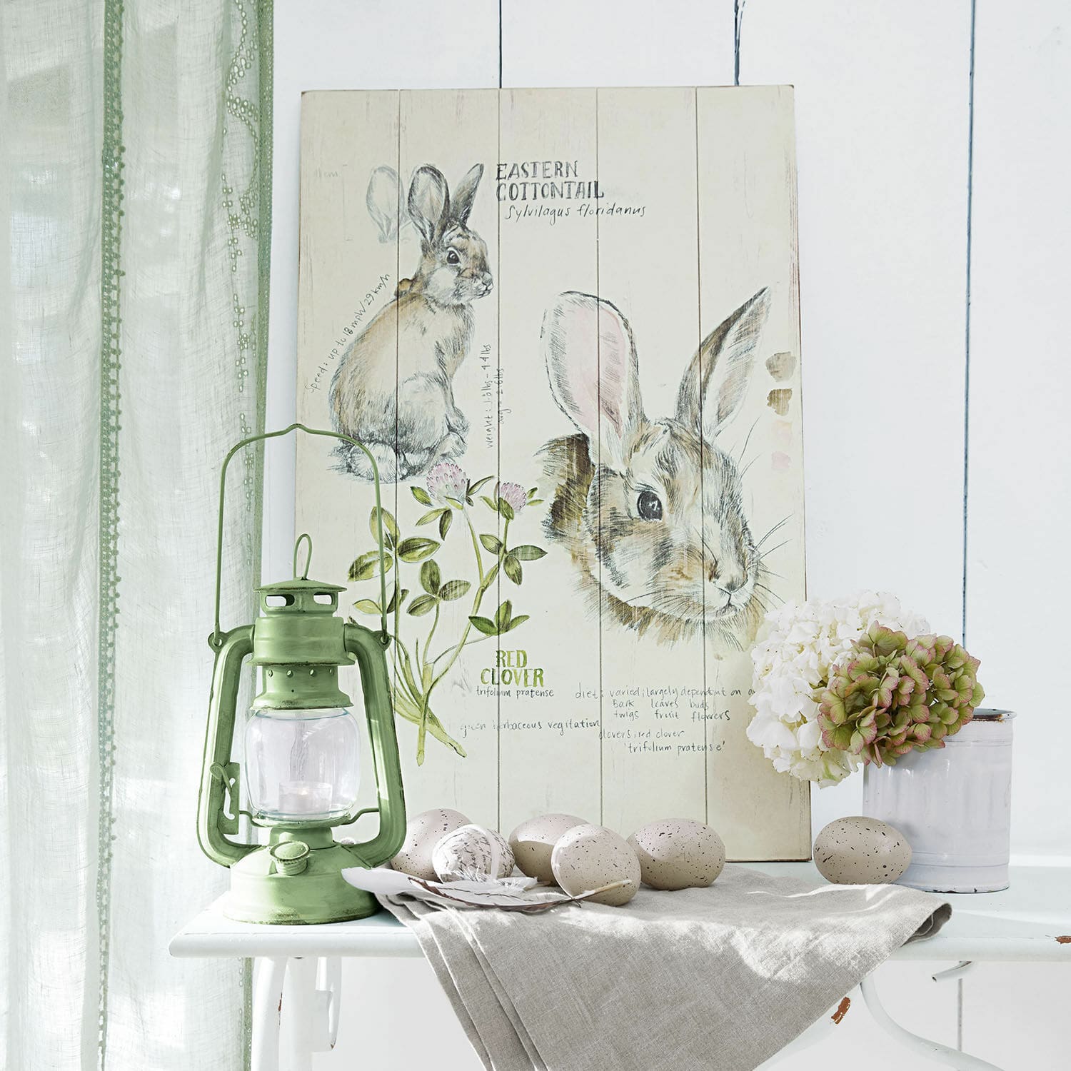 Panneau décoratif Luppis Tableau en bois décoratif avec illustration de lapin et trèfle, lampe à pétrole verte et œufs décoratifs